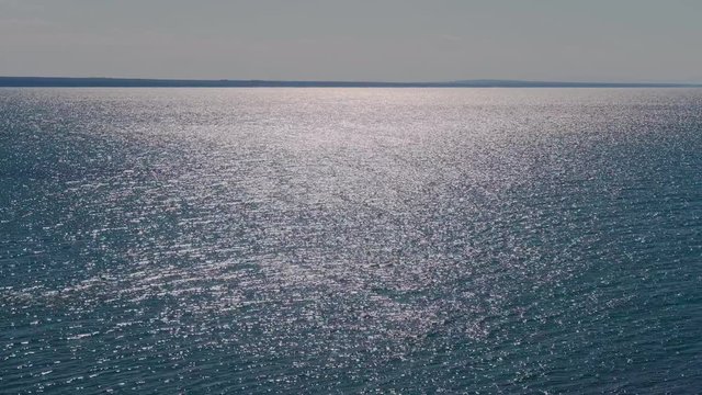 Beautiful glare of the sun on the surface of the sea