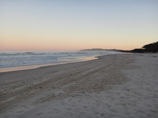 sunset on the beach - byron bay - australia