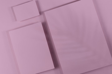 Mosk up. Abstract pink paper background. Three cards of different sizes on a paper background. Shadow falls on an abstract background. Close-up, horizontal, flat lay, lots of free space. Toning pink.