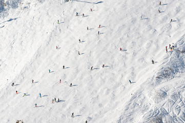 skiers on a ski slope in the distance