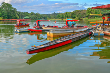Fototapeta premium MALACCA, MALAYSIA : 12 Feb 2016 - Boat on the lake with green nature background at Ayer Keroh Lake, Malacca, Malaysia.