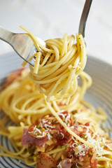 Garlic and bacon spaghetti on plate