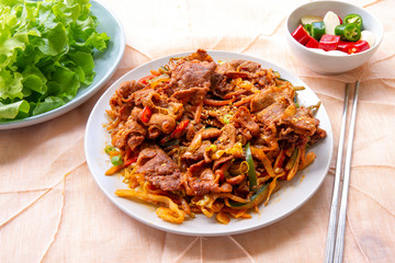 Stir fried with pork and vegetables sprinkle sesame seeds