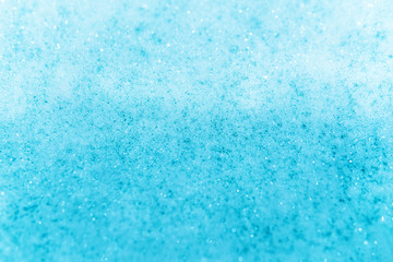 Light blue bath foam bubbles texture background.