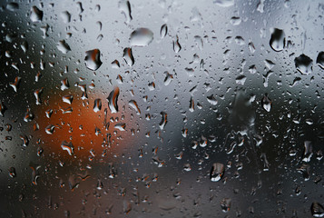 Close-up view of the rain drops on the glass