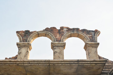 Fototapeta premium A brick stone arch or structure. Space for text