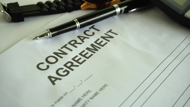 contract agreement document for sign with pen