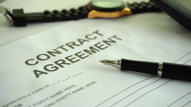 contract agreement document for sign with pen