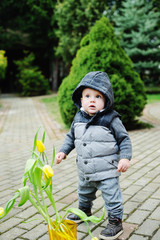 Baby boy with tulips