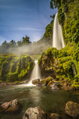 Beautiful Patagonian waterfall in a forest lit by the rising sun of Patagonia