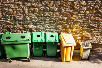 Design of garbage bins for recycling in Andorra. Green for glass, yellow for plastic.