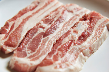 Fresh raw pork belly on plate