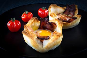 Toast bread with cheese, bacon, egg and tomatoes