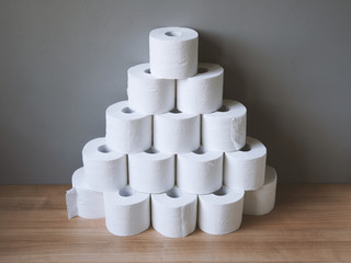 stacked and hoarded of toilet paper rolls - panic buying and shortage in times of corona crisis