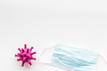 Corona virus Covid-19 - disease protection concept with medical face mask - on white background top-down copy space