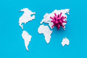 Corona virus Covid-19 - epidemic concept with world map - on blue background top-down