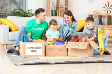 Volunteers with donations and children at orphan home