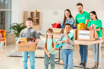 Volunteers with donations and children at orphan home