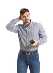 Sad man with empty purse on white background