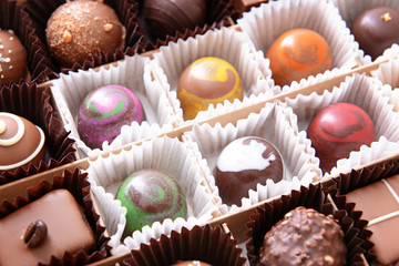 Box with delicious candies, closeup