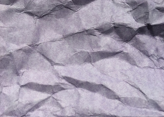 Abstract modern purple crumpled paper texture background.
