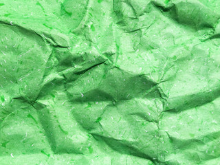 Pattern of green crumpled paper texture background.