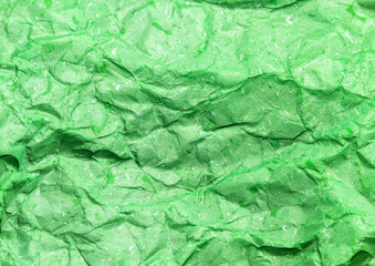 Pattern of green crumpled paper texture background.