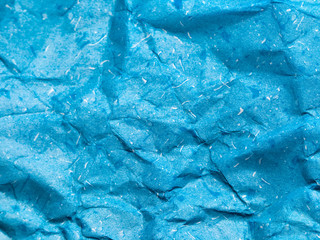 Texture of blue crumpled paper background for design