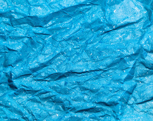 Obraz premium Texture of blue crumpled paper background for design