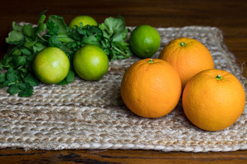 green lemons, yellow oranges on the table