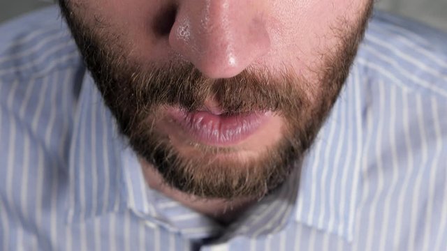 Man coughs and covers her mouth with napkin. Colds, flu, laryngitis, tuberculosis, asthma, bronchitis, allergies, pneumonia, APF inhibitors, nasopharyngeal leakage concepts. Top view. Close-up