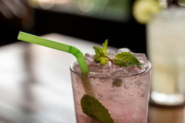 Refreshing Lemon and Lime Soda in a Glass. Cold homemade lemonade with mint and lime. Glass of iced lemonade soda, cold drink in summer.