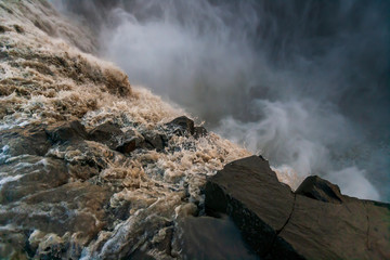 Beautiful Icelandic waterfall at sunset with huge quantity of flowing waters Iceland
