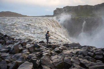 Beautiful Icelandic waterfall at sunset with huge quantity of flowing waters Iceland