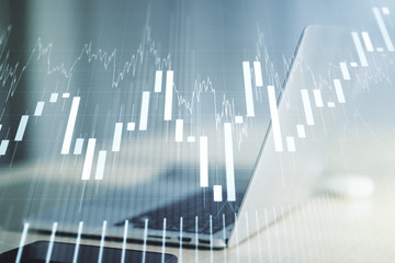 Abstract creative financial graph on modern laptop background, forex and investment concept. Multiexposure