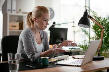 Young woman at work. Beautiful businesswoman working in office.	
