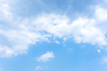Naklejka na ściany i meble Beautiful form of white fluffy clouds on vivid blue sky in a suny day