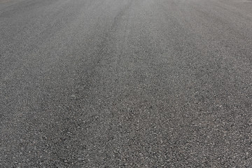 Fototapeta na wymiar Gray asphalt road tarmac background