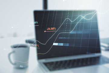 Multi exposure of creative statistics data hologram on laptop background, stats and analytics concept