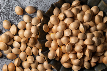 Ginkgo nuts in rusty metal tray 