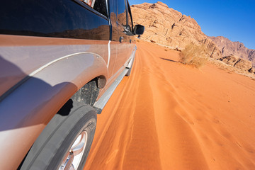 Fototapeta na wymiar Safari in desert Wadi Rum. Motion blur, selective focus.