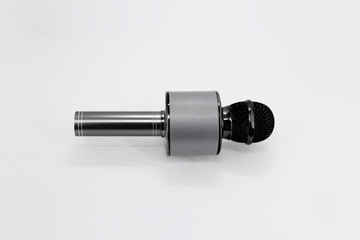 Black toy microphone for karaoke. Karaoke microphone isolated on a white background.