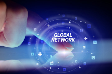 Finger touching tablet with social media icons and GLOBAL NETWORK