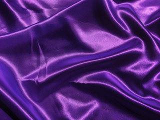 Beautiful smooth purple fabric texture background with copy space for design