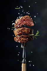 Fototapeta Grilled ribeye beef steak with rosemary and salt. obraz