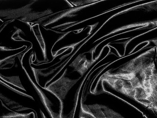 luxury black silk or satin texture background with liquid wave or wavy folds. Wallpaper design