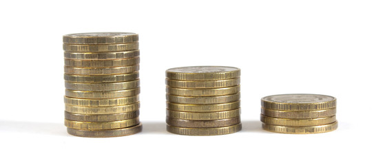 Three columns of metal coins were one in a descending order on a white background.
