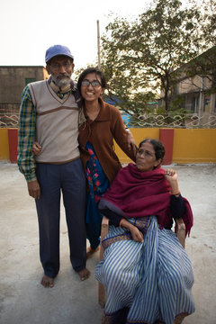 A Cheerful Indian Bengali Family In Winter Garments Enjoying In A Sunny Winter Afternoon On A Rooftop. Indian Lifestyle.