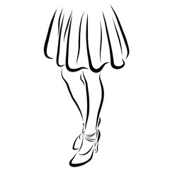 slim legs of a girl in a full skirt and high-heeled shoes