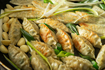 Pan fried dumpling with scallion and garlic